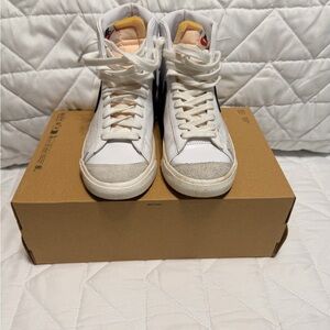 Nike High-Top Sneakers in White with Black Swoosh and Tan Accents